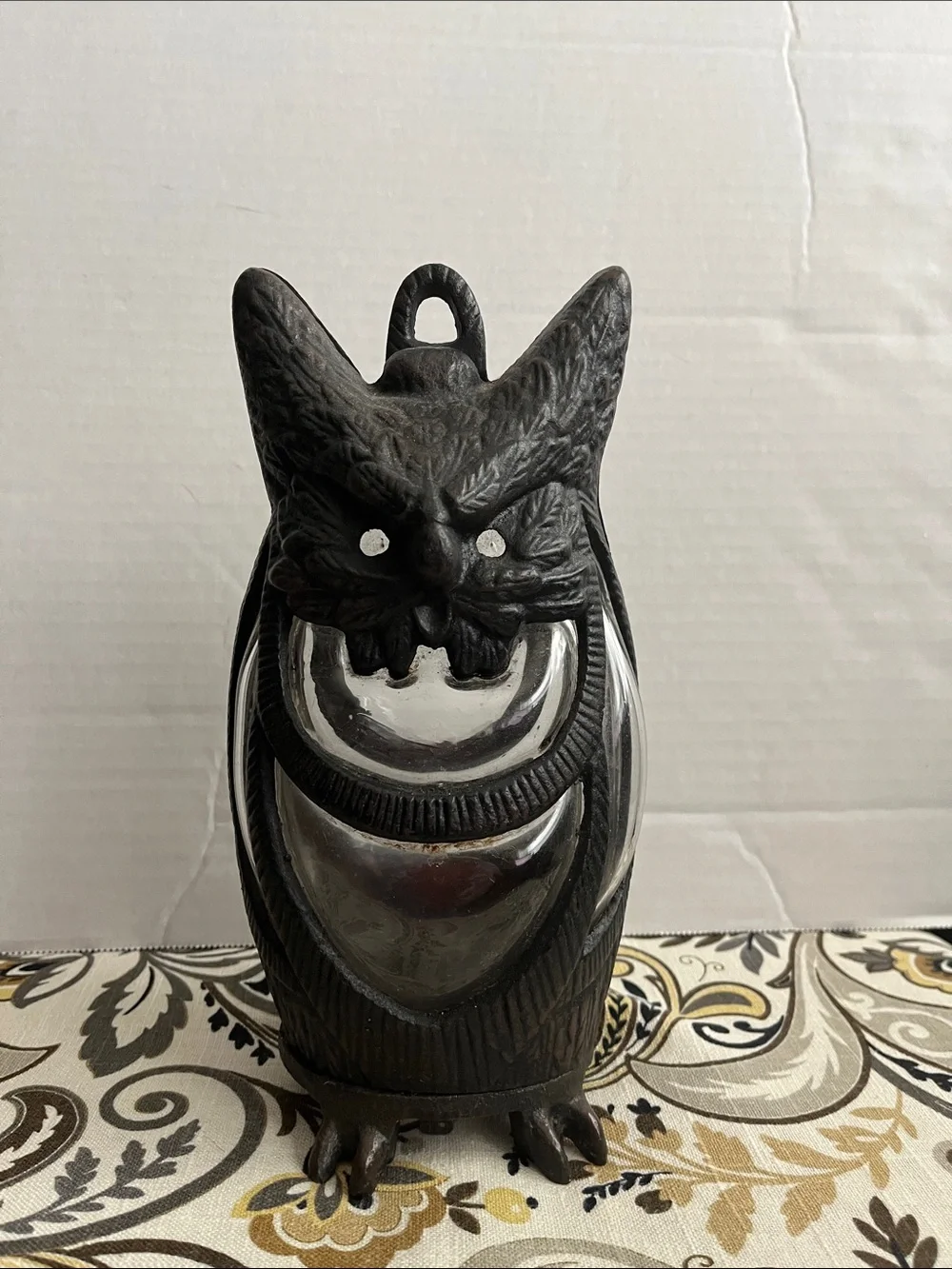 Cast iron owl candle holder lantern with hand blown glass.